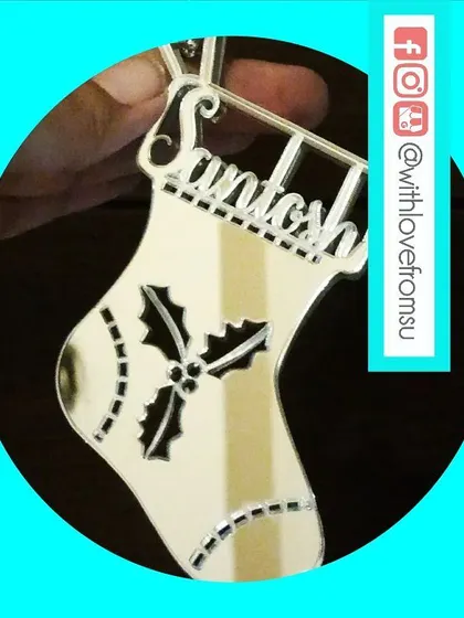 A classic Christmas stocking shape, reimagined as a sleek, personalized acrylic ornament. This one is perfect for adding a modern touch to your tree decorations.