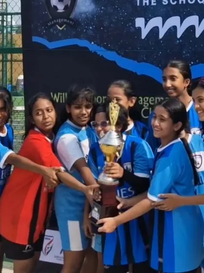 A powerful image of our women's team holding their first trophy. This picture represents a milestone for our academy and the growth of our women's program.