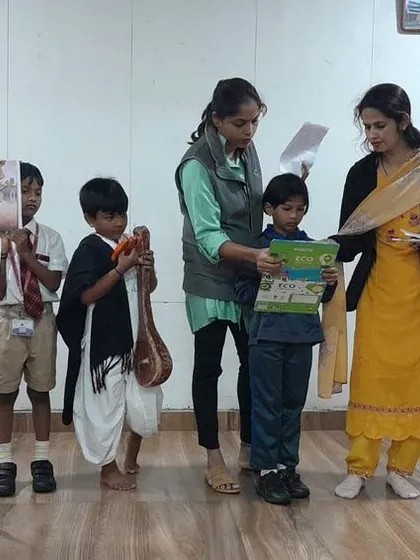Students present on the life and teachings of the poet-saint Kanakadasa during a special assembly for Kanakadasa Jayanti.