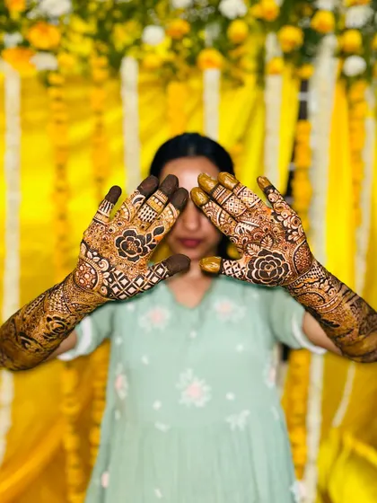 A playful pose showing off the back of the hands, which feature the groom's name and initial.