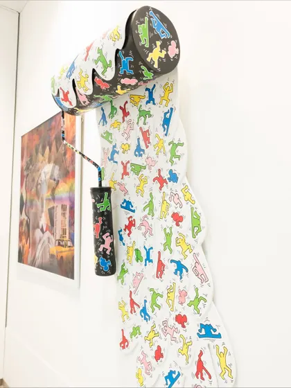 A side view of the "Dripping Pop" installation, showing how it extends from the wall to create a sense of motion.