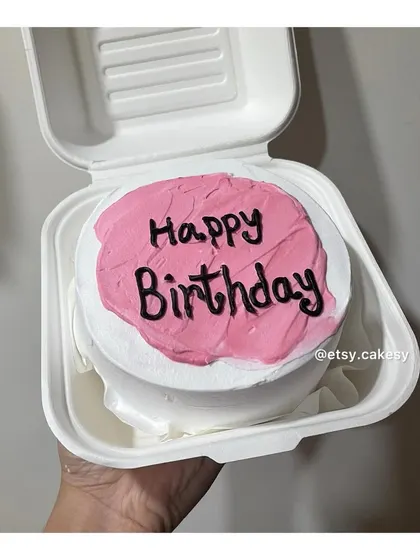 A simple pink and white bento cake for a happy birthday message.
