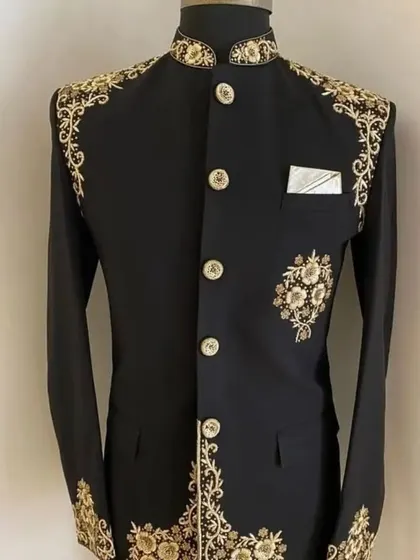 A black Jodhpuri jacket with stunning gold embroidery along the edges and shoulders. This is a very royal and eye-catching design.