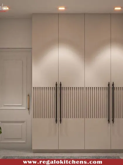 A unique wardrobe design featuring a central band of fluted texture and long, elegant black handles. This detail adds a touch of artistry to a simple and functional piece.
