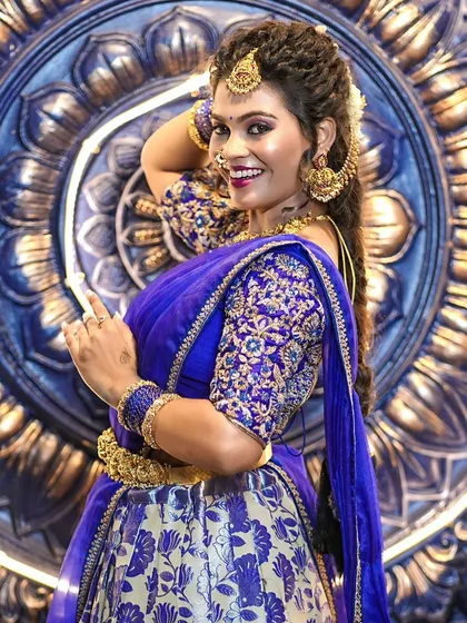 The royal blue blouse is brought to life with detailed gold embroidery. This kind of craftsmanship is what we pride ourselves on for our custom bridal wear.