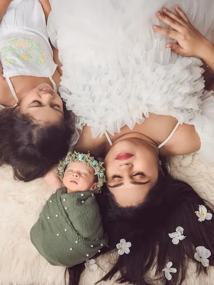 A mother's love. This beautiful overhead shot of a mom with her two daughters is a tender and artistic way to capture their connection.