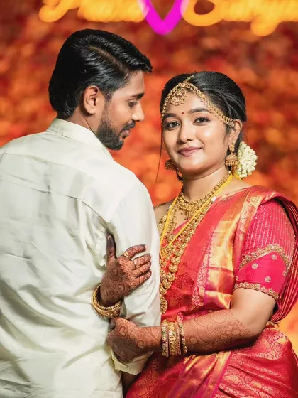 A lovely portrait where the groom's simple elegance shines through, perfectly matching the bride's traditional beauty.