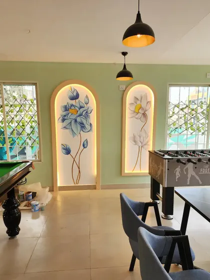 A view of the game area at Essence Cafe, where we installed two custom floral murals. The art is framed in arched niches with integrated backlighting to make them stand out as feature elements.