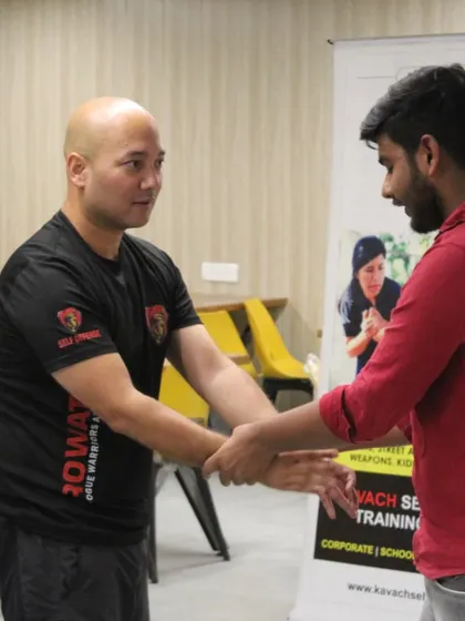 A close-up of me providing one-on-one instruction during a workshop. Personal attention is key to ensuring each participant understands the mechanics and feels confident in their ability to execute the technique.