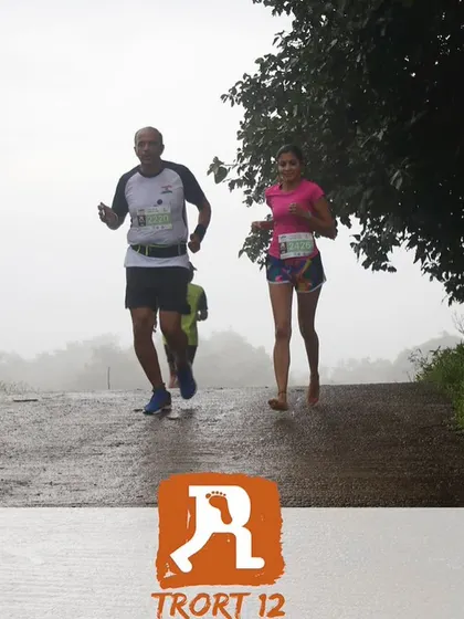Running alongside a fellow athlete. The mutual encouragement on the course is what makes the running community so powerful.