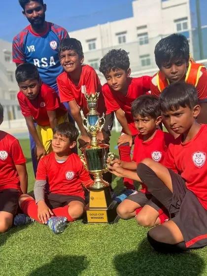 Our U11 team celebrating their Gold Cup win, part of a clean sweep for the academy at the GIG International School tournament.