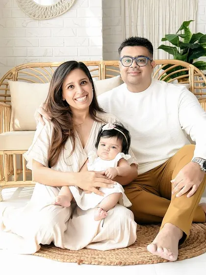 A beautiful family of three, perfectly coordinated in our natural-themed studio. These are the portraits that become treasured family heirlooms.