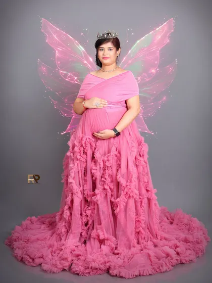 A magical transformation. We added sparkling fairy wings to this portrait, turning a beautiful photo in a pink ruffled gown into a whimsical fairytale moment.