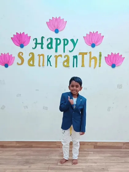 A duplicate of a previous image, showing a student enjoying the Sankranti celebration.
