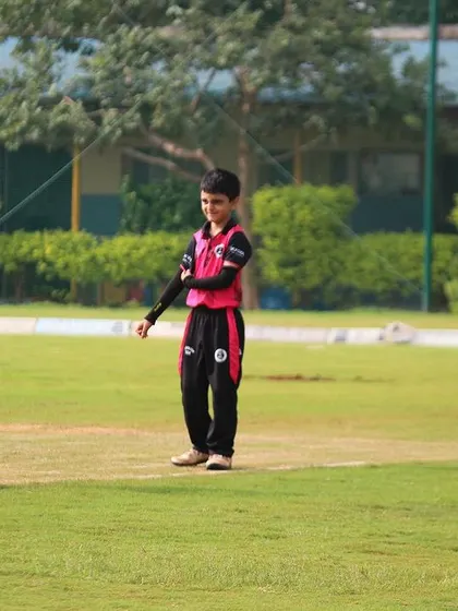 A young fielder on the outfield during a U-10 match.