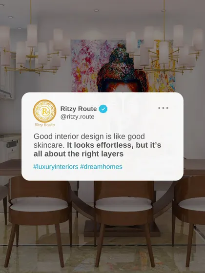 Good interior design is like good skincare; it's all about the right layers. This dining space showcases this with its layered lighting, colorful art, and elegant furniture.