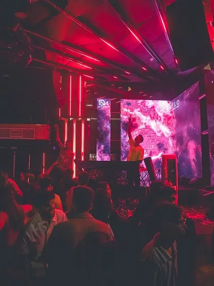 A sea of people under the red lights at FLO. This shot perfectly captures the scale and intensity of the nights I curate.