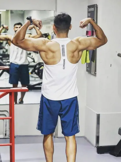 A strong back is the foundation of a strong lifter. This pose shows the result of consistent training on the muscles that power every pull and lift.
