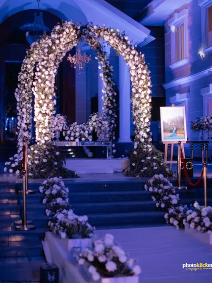 An enchanting floral archway and entrance decor, setting a magical tone for an evening reception. We pay close attention to capturing the details of your wedding decor.