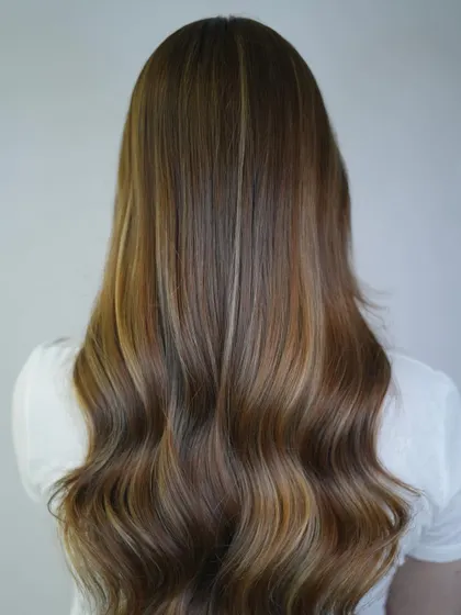 This look combines the best of both worlds: a deep brunette base with striking blonde highlights for a high-contrast, statement-making style.