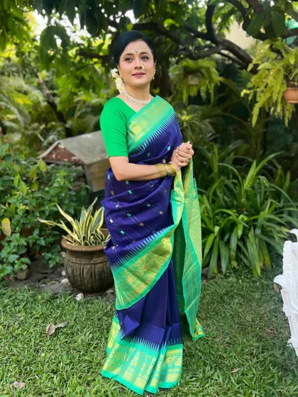 A full-length portrait in a beautiful garden setting.