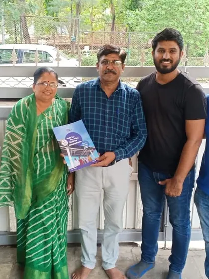 A multi-generational family stands with our team, ready to embrace a sustainable lifestyle.