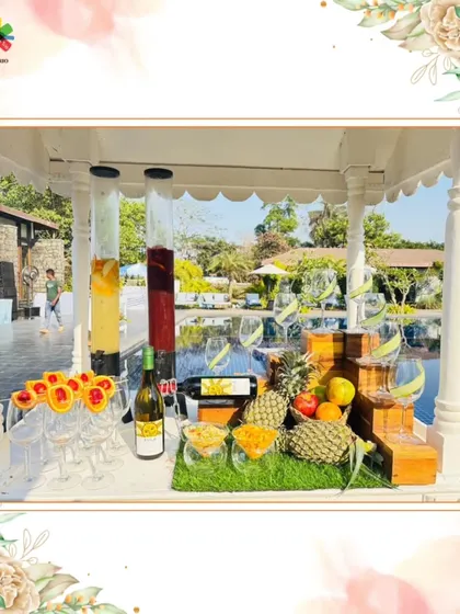 Our Sangria Wine Bar set up by the pool for a brunch wedding. The large glass dispensers showcase the colorful, fruit-filled wine, creating an inviting and refreshing station.