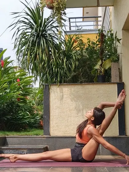 A beautiful moment of deep stretching outdoors. This pose targets the hamstrings and hips, and practicing in nature adds another layer of peace to the experience.