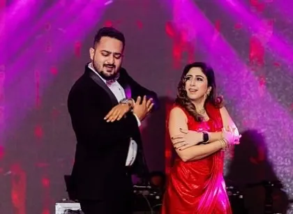 A couple enjoying their coordinated dance routine. These are the fun, shared moments that make a sangeet performance so special.