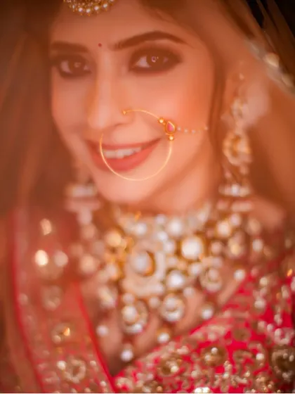 A soft and dreamy close-up of the bride, shot through her veil. This classic technique creates a romantic and ethereal bridal portrait.