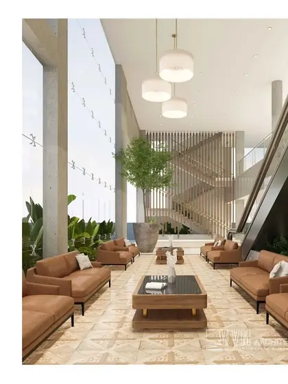This render shows the proposed lobby for the Sree Gokulam Convention Centre in Kumarakom. The design features a double-height glass wall to maximize natural light, creating a grand yet welcoming entrance with modern furnishings and a clean, sophisticated palette.