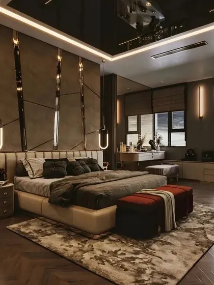 This high-end bedroom design features a reflective ceiling, dramatic wall paneling, and layered lighting for a truly luxurious feel.