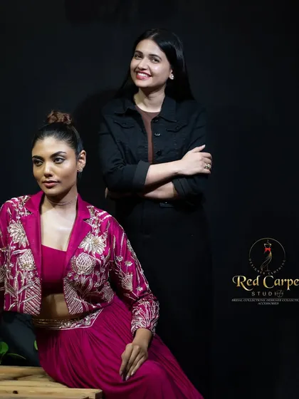 A behind-the-scenes moment with the model and me. It’s always a joy to see my designs come to life and ensure every detail is perfect before the camera rolls.