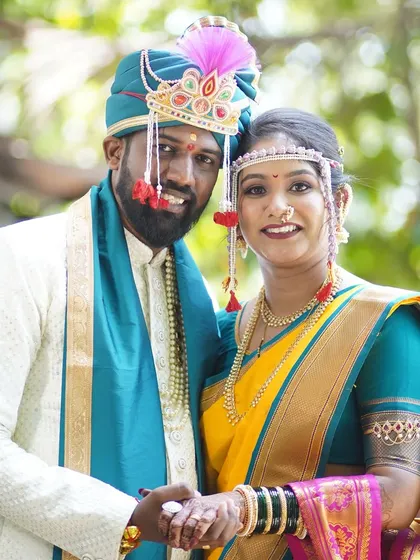 A classic portrait of the happy couple. The bride's makeup is perfectly coordinated with her attire, creating a harmonious and visually stunning look.