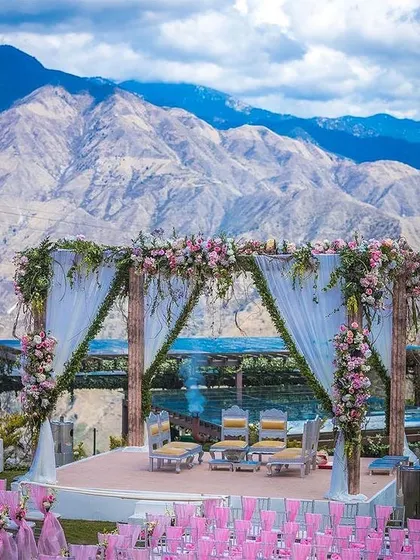 We specialize in finding and managing spectacular destination wedding venues. This breathtaking mountain-view mandap combines natural beauty with elegant decor for a truly unforgettable ceremony.