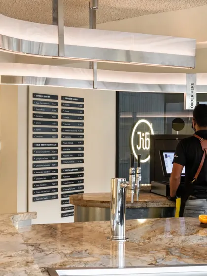 The point of sale, integrated into the stone countertop of the brew bar.