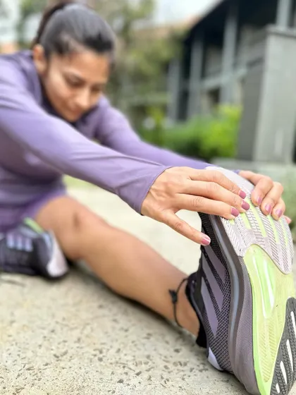 A duplicate of image 85. Stretching after a run in my Supernova Rise shoes.
