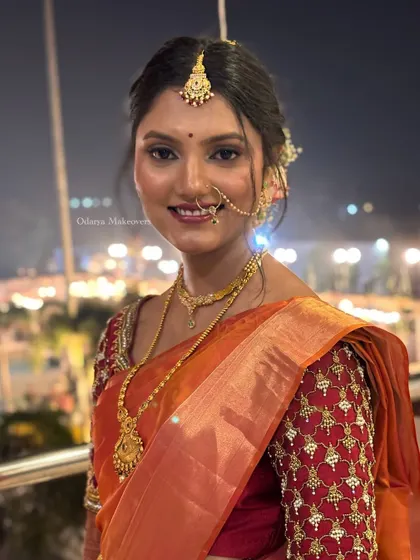 The joy of a bride on her special day. This candid shot captures her radiant smile, enhanced by a makeup look that is both traditional and fresh, perfect for wedding photography.