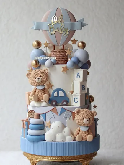 A cute teddy bear and cars cake, perfect for baby showers and first birthdays.