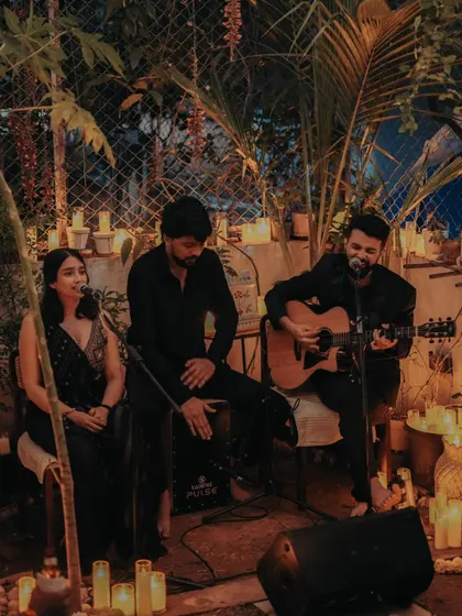 Guitar and voices fill a candlelit corner during our private Diwali evening, with @neha.rd_ joining us.