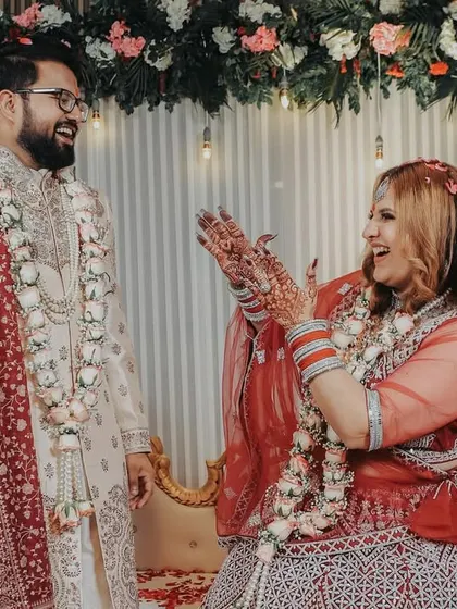 Pure joy and laughter! This candid shot from a ring ceremony perfectly captures the fun and energetic vibe of the celebration.
