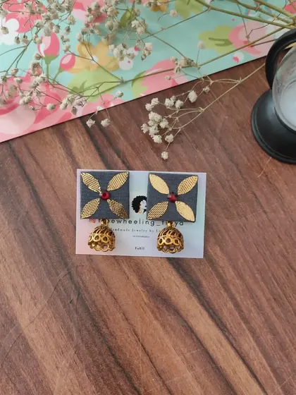 My gotapatti earrings are a festive favorite. These square fabric studs feature golden gotapatti work and a small jhumki drop, available in brown, green, and grey.