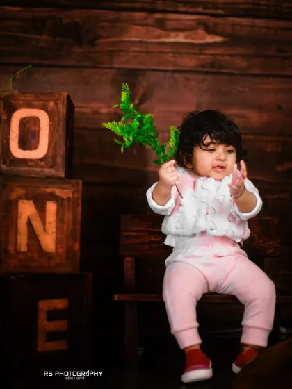Another take on our rustic first birthday set, this time with a focus on the wooden "ONE" blocks against a dark wood panel backdrop. It's a great option for a more classic, timeless feel.