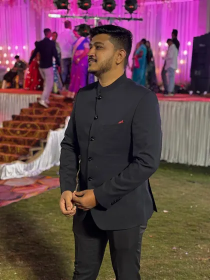A client looking smart and comfortable in our simple black Jodhpuri suit. This is a versatile outfit that can be rented for various occasions, from parties to weddings.