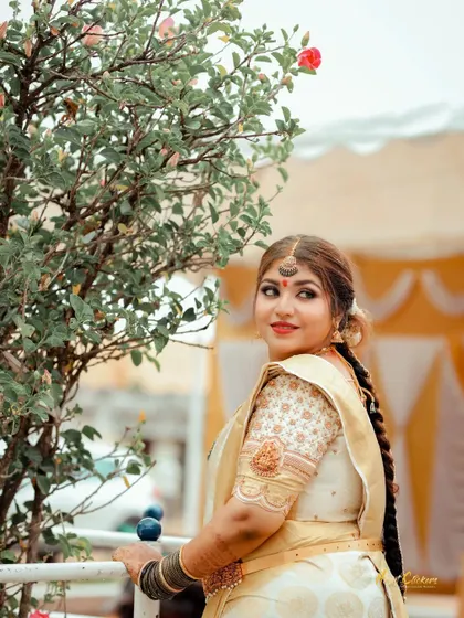 A candid outdoor portrait of the bride looking over her shoulder with a gentle smile.