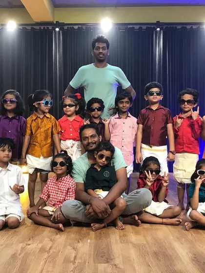 Another great shot from our themed dress-up day. Posing with their instructors, the kids show off their cool sunglasses and traditional attire.