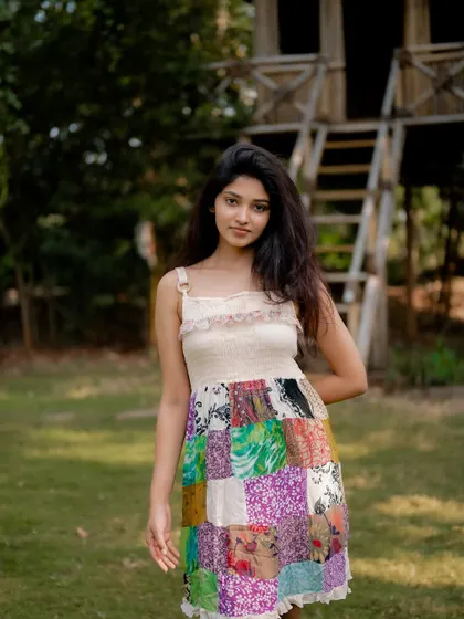 A portrait of actress Rachana Inder in a park. Her natural pose and the beautiful outdoor setting create an authentic and lovely image.