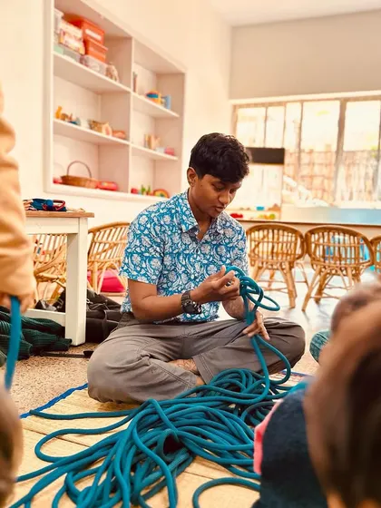 An outdoor educator demonstrates a knot-tying technique. His patience and expertise created a focused and engaging learning experience for our kindergarteners.