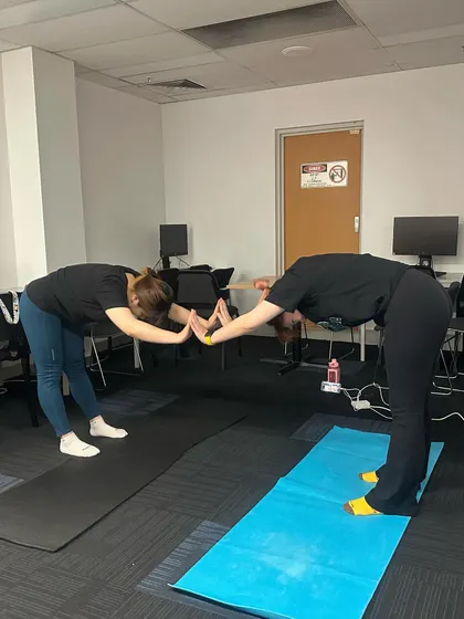 A partner forward fold stretch to help each other go deeper into the posture. This is a great way to build trust and assist one another.