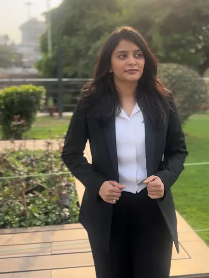 Adjusting my blazer, ready for what the day holds. My reputation is built on results, and I work hard to maintain it for every client.